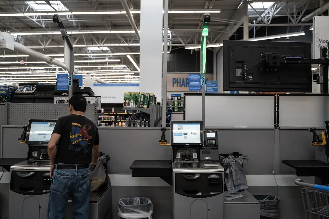 a person standing in a room with computers and other equipment